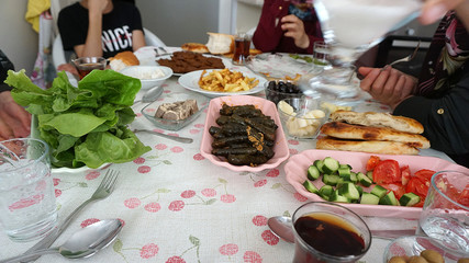 Turkish breakfast table and turkey specific foods, raw meatballs (cig kofte) leaves stuffed patatas fries etc ...