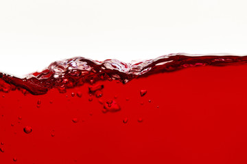 red bright liquid wave with bubbles isolated on white