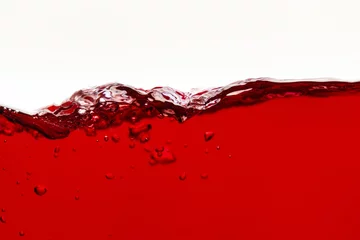 Keuken spatwand met foto red bright liquid wave with bubbles isolated on white © LIGHTFIELD STUDIOS