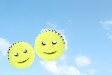 happy icon Foam sponges smiley face family with copy space in sky background
