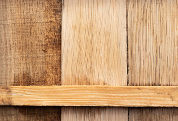 Background in the form of three wide wooden vertical planks and one narrow horizontal wooden bar