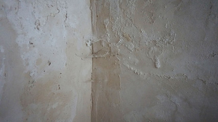 the wall with its paint pouring and swelling due to moisture,