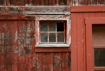 Weathered red paint and broken windows are a common site on barns in Vermont