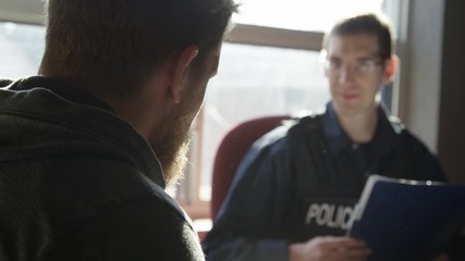 Police officer in precinct solving crimes