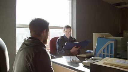 Police officer in precinct solving crimes