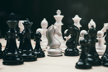 Chess knights head to head.black and white chess battle,Chess victory,chess concept. strategy, management or leadership concept. © Looker_Studio
