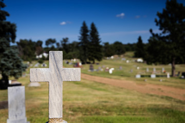 Cross grave marker at rural cemetary