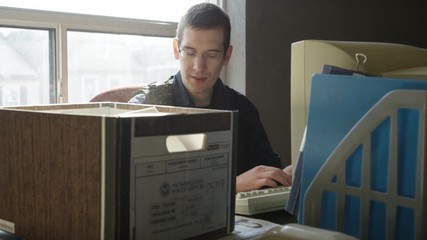 Police officer in precinct solving crimes