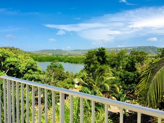 Fototapeta premium View from the resort balcony on pond and hills of countryside in Holguin, Cuba