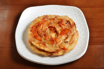 Fried Chinese flatbread eaten as a snack or with a meal.