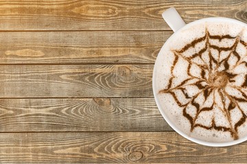 Cup of coffee on wooden background
