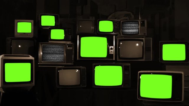 Stacked Retro TVs turning On Green Screens. Sepia Tone. You can replace green screen with the footage or picture you want with &ldquo;Keying&rdquo; effect in AE (check out tutorials on Internet).
