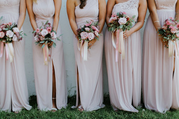 bridesmaids holding wedding bouquets, pink bridesmaids dresses, detail shot, copy space - obrazy, fototapety, plakaty