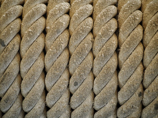 Close up old brown giant fiber rope on an ancient warship