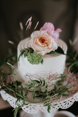 Small White Wedding Cake with flowers on top, peonies on wedding cake