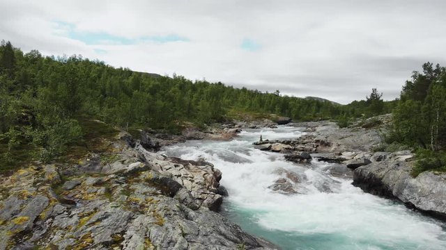 Beautiful wild river, shot in Norway.
Waterfall filmed from left to right with drone