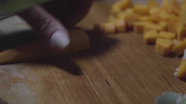Women's hands wash, peel and cut vegetables into vegetable stew.