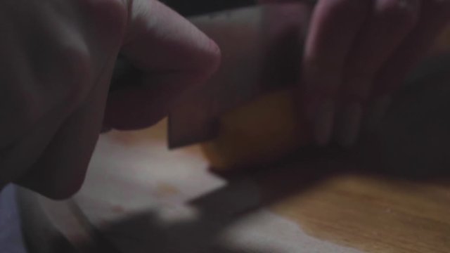 Women's hands wash, peel and cut vegetables into vegetable stew.