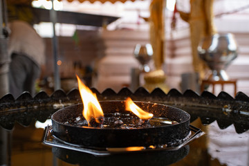 Fire for lighting candle and incense in Buddhist temple