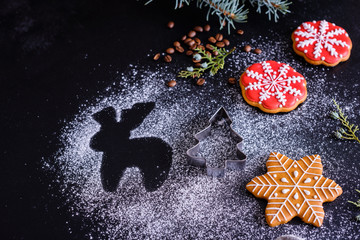 Christmas homemade gingerbread cookies on a dark background