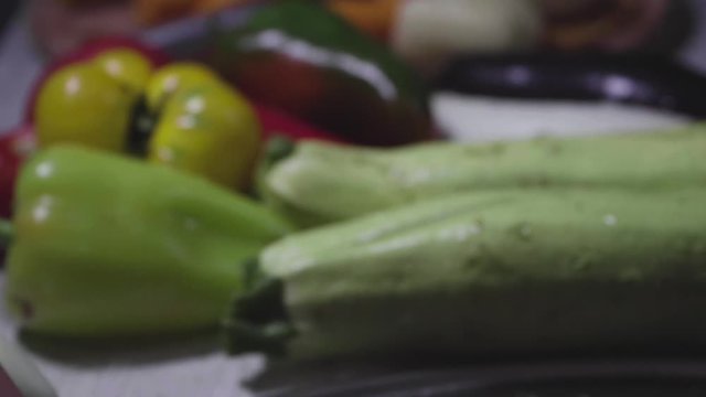 Women's hands wash, peel and cut vegetables into vegetable stew.