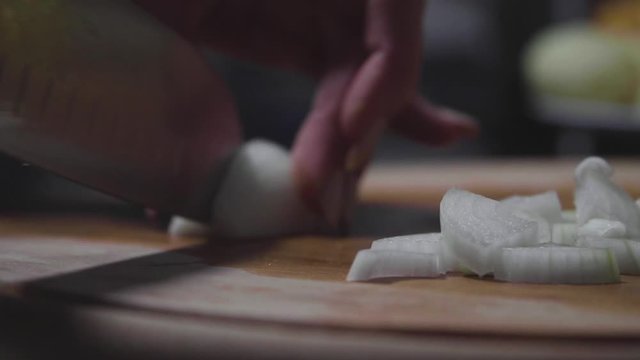 Women's hands wash, peel and cut vegetables into vegetable stew.