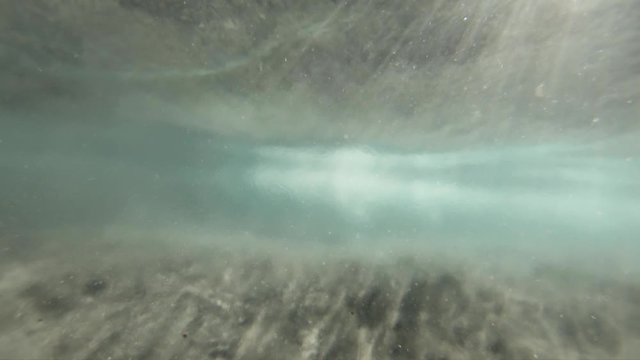 underwater view of shipman beach waves in slow-motion, glittering sand and brackish water makes for some amazing shots