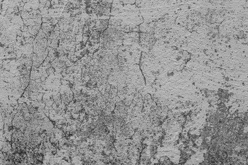 Texture of a concrete wall with cracks and scratches which can be used as a background