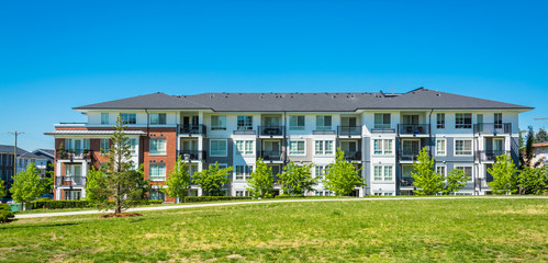 Brand new apartment building on sunny day in British Columbia, Canada.