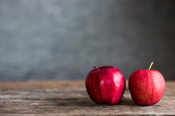 red apples on the wooden floor.