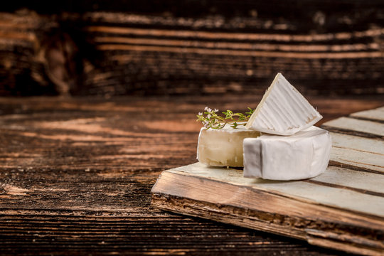 Brie. Camembert. White-mildew soft cheese slice macro shot