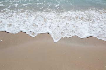 Soft wave with foam of ocean on the sandy beach,Sea wave,Holiday with Soft wave