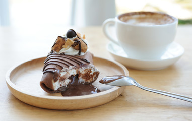 Chocolate lava cake and Capucino coffee put on table,Relax time with coffee and cake,selective focus