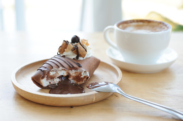 Relax time with Chololate lava cake and cappucino coffee on wooden table, coffee time