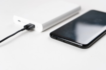 smartphone is charging from the power bank