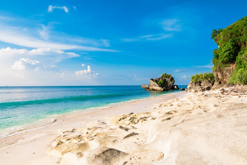 Tropical beach with blue ocean, sky and sunshine in Bali