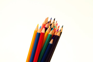 Colored pencils on white background