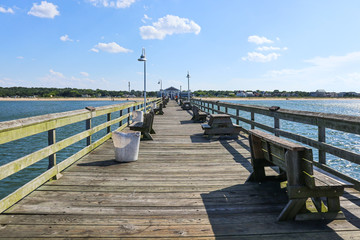 A view towards the shore on the Ocean View fishing pier in Norfolk, Virginia.