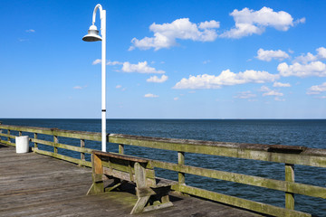 A bench on the Ocean View fishing pier in Norfolk, Virginia.
