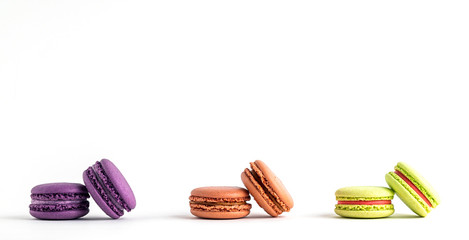 colourful macaroons on white background.