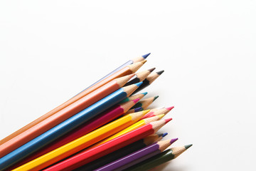 Colored pencils on white background