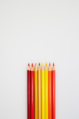 Red and Yellow Color pencils  on white