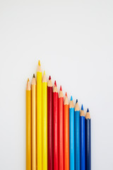 Colorful wooden pencils for drawing on white