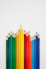Colorful wooden pencils for drawing on white
