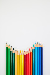 Colorful wooden pencils for drawing on white