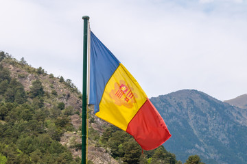 National flag of Andorra on a flagpole.