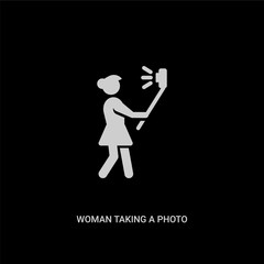 white woman taking a photo vector icon on black background. modern flat woman taking a photo from people concept vector sign symbol can be use for web, mobile and logo.