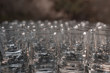 Close-up of many glass glasses in a bar