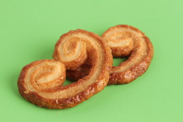 Puff pastry cookies on colorful background