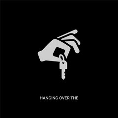 white hanging over the key vector icon on black background. modern flat hanging over the key from guestures concept vector sign symbol can be use for web, mobile and logo.